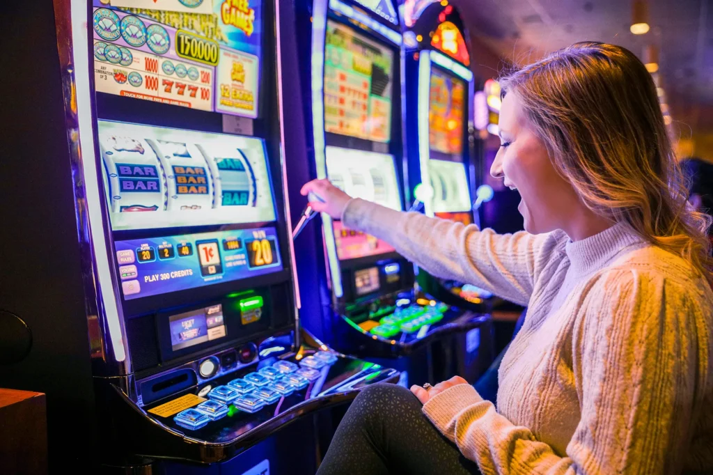 Mazatzal Casino - Woman smiling at slots